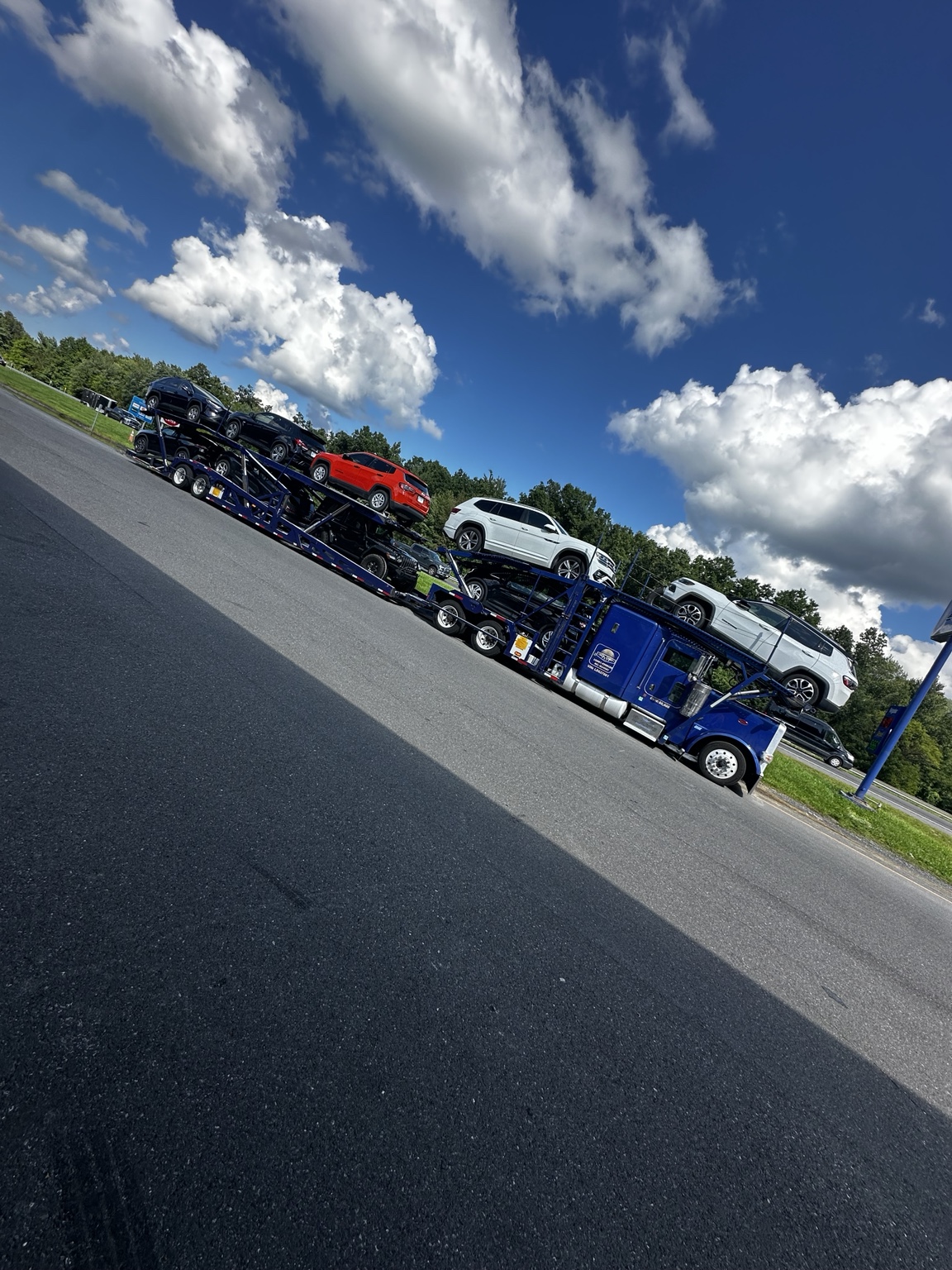 Golden Auto Transport blue loaded car carrier